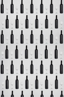 Dark wine bottles and glasses creative dark and textured abstract background
