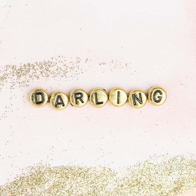 Free photo darling beads lettering word typography