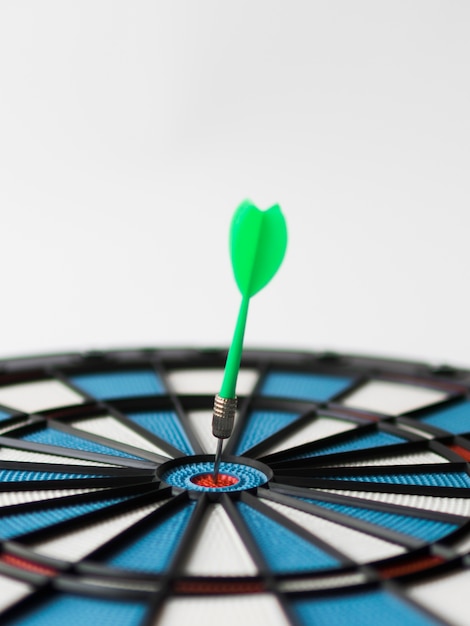 Dart stuck in bull's-eye on defocused dart board