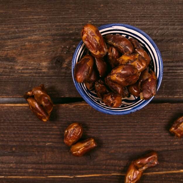 Dates fruit in bowl on table