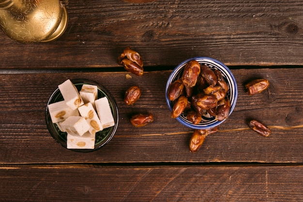 Free photo dates fruit in bowl with turkish delight