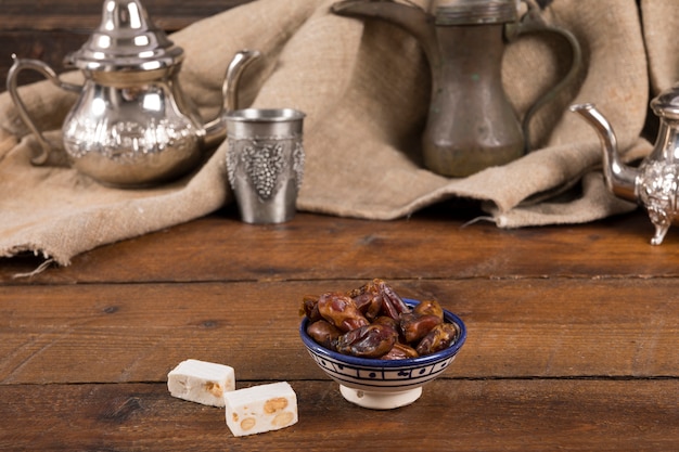 Dates fruit with Turkish delight on table