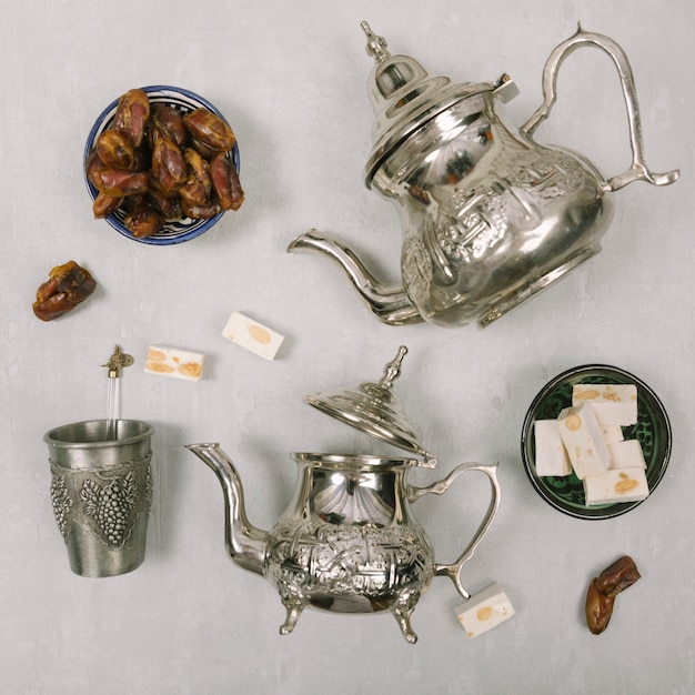 Dates fruit with Turkish delight and teapots