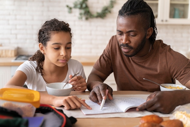 Daughter and father doing homework