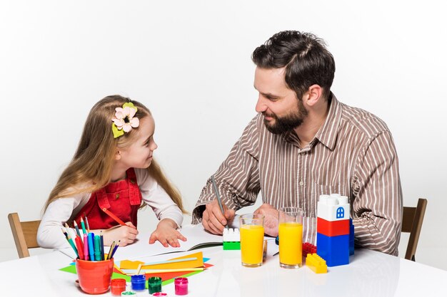 daughter and father drawing together