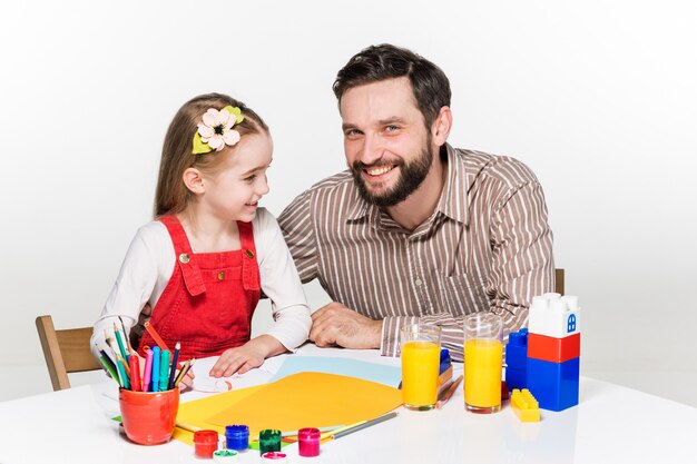 daughter and father drawing together
