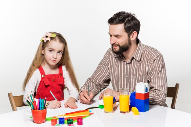 The daughter and father drawing together