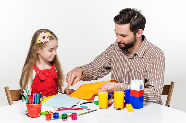 The daughter and father drawing together