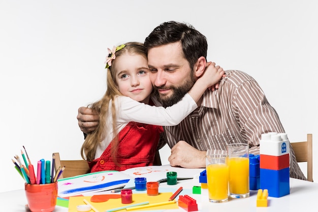 Free photo the daughter and father drawing together