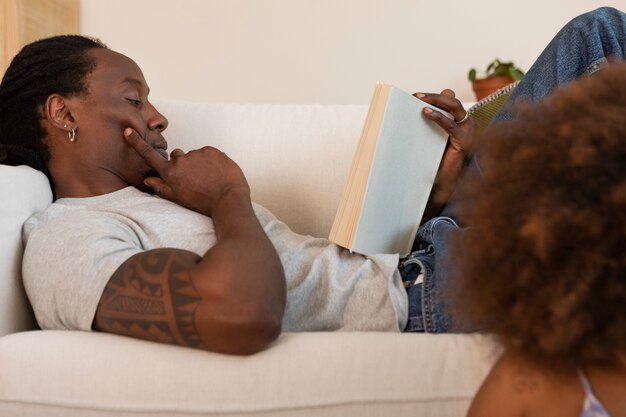 Daughter and father relaxing at home