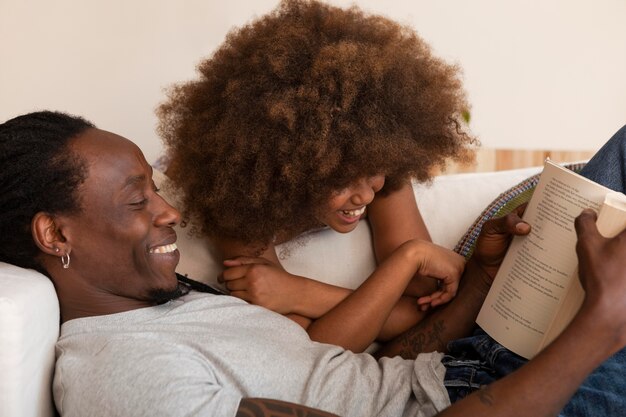 Daughter and father relaxing at home