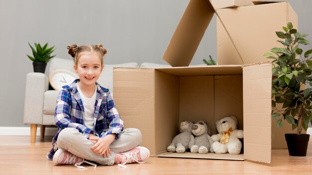 Daughter helping packing the boxes