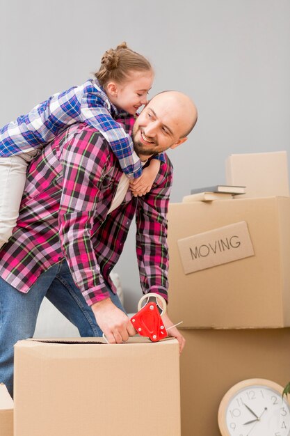 daughter helping packing the boxes