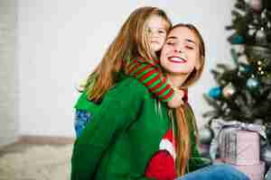 Free photo daughter hugging mother