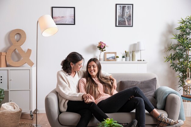 Daughter and mother on couch