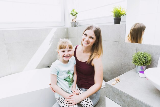 Daughter and mother looking at camera