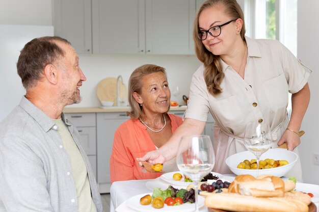 Daughter visiting her parents at their home