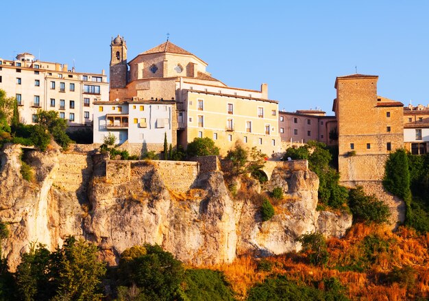 Day picturesque view of houses on rock in Cuenca