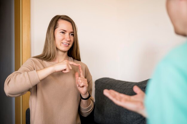 Deaf woman communicating through sign language