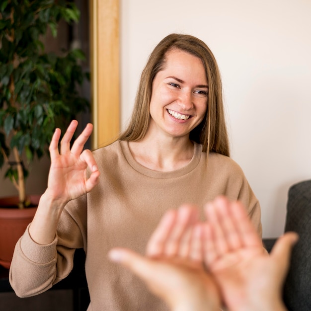 Deaf woman communicating through sign language