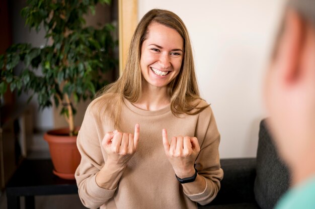 Deaf woman communicating through sign language