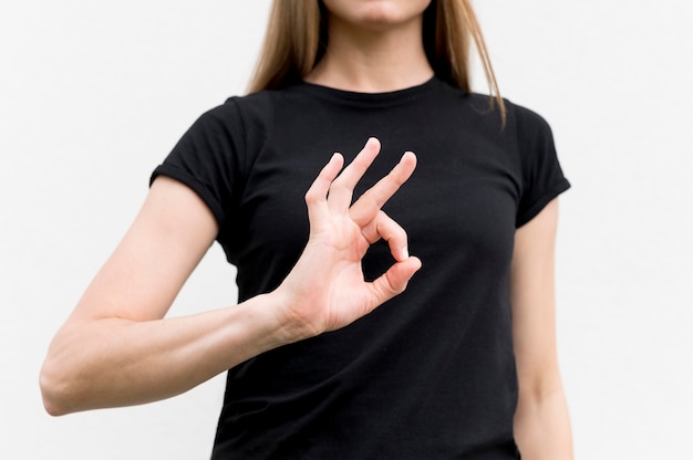 Free photo deaf woman communicating through sign language