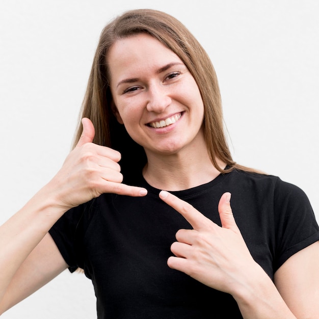 Free photo deaf woman communicating through sign language