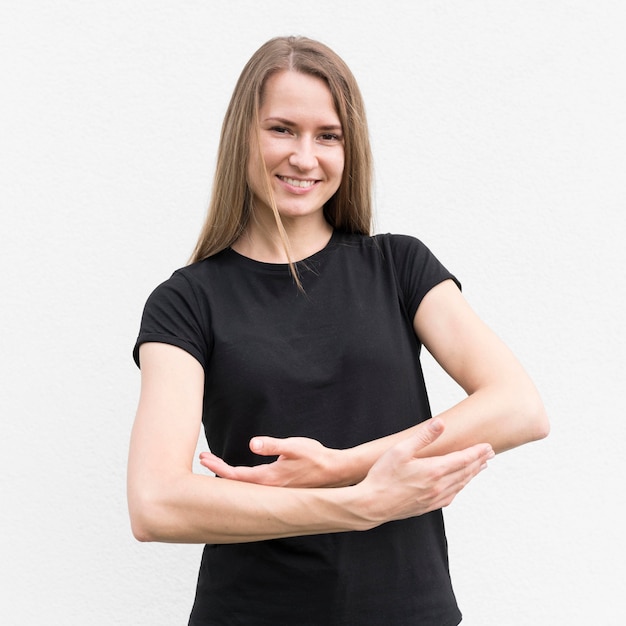 Free photo deaf woman communicating through sign language