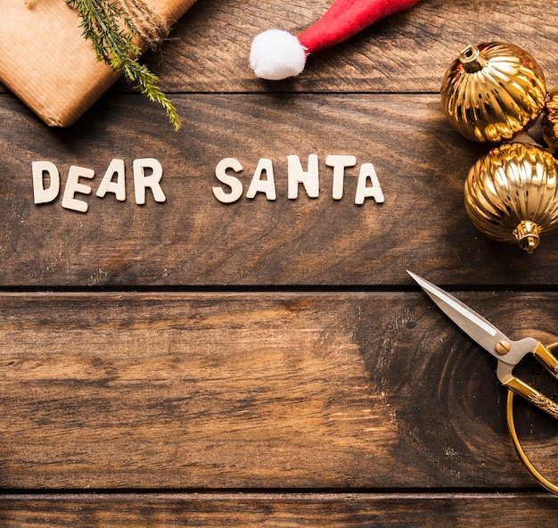 Dear Santa title near present box and ornament balls