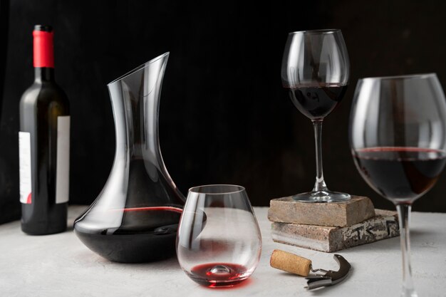 Decanter and glass with wine on table assortment