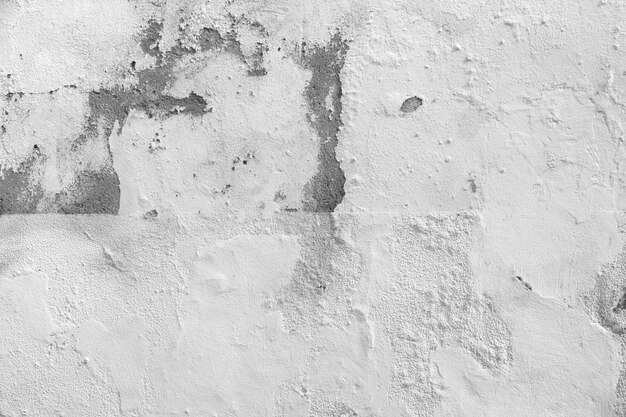 Decaying white concrete wall