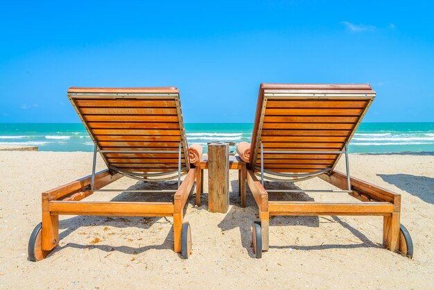 Deck chairs with sea background