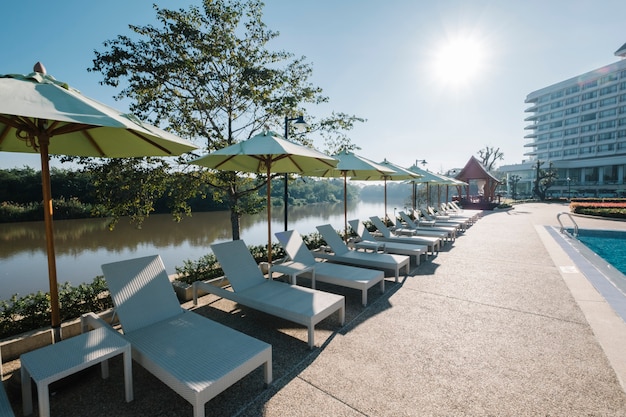 Deckchair and swimming pool in hotel