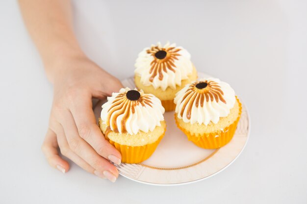 Decorated cupcakes on small plate