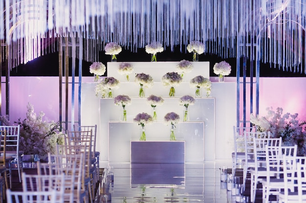 Decorated wedding ceremony venue in white and purple