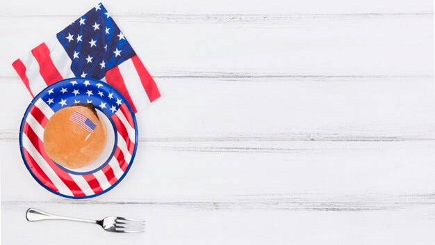 Decorated with USA flag plate, napkin and fork on table