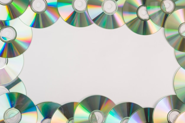 Decoration of compact discs with space for text on white background