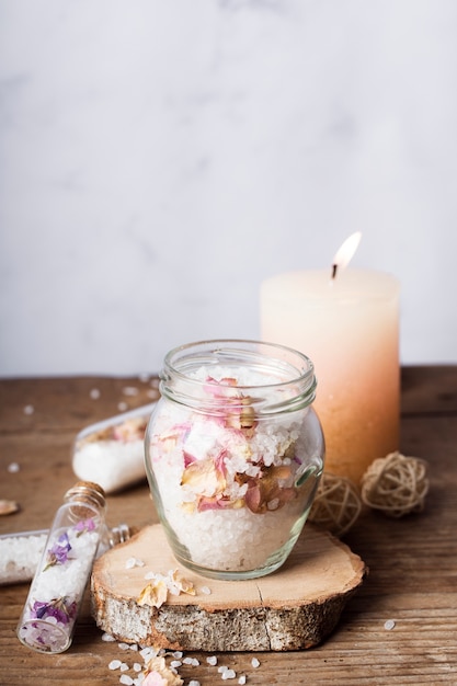 Decoration with salts in jar and candle