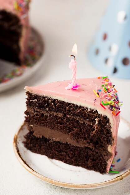 Decoration with slice of cake and candle