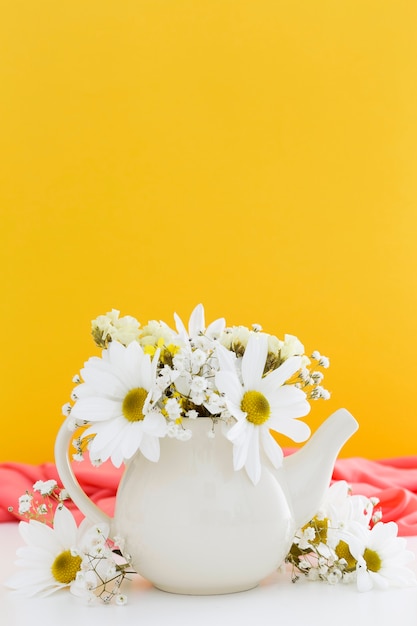 Decoration with white daisies and yellow background
