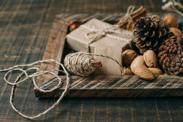 Decoration with wooden frame and cones