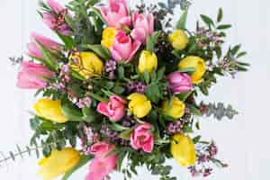 Free photo decorative bouquet with pink and yellow tulips