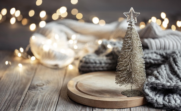 Decorative christmas tree on blurred background with bokeh