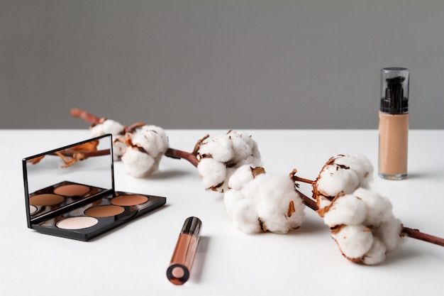 Decorative cosmetics on white table.