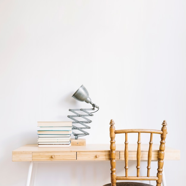 Decorative desk with books and lamp