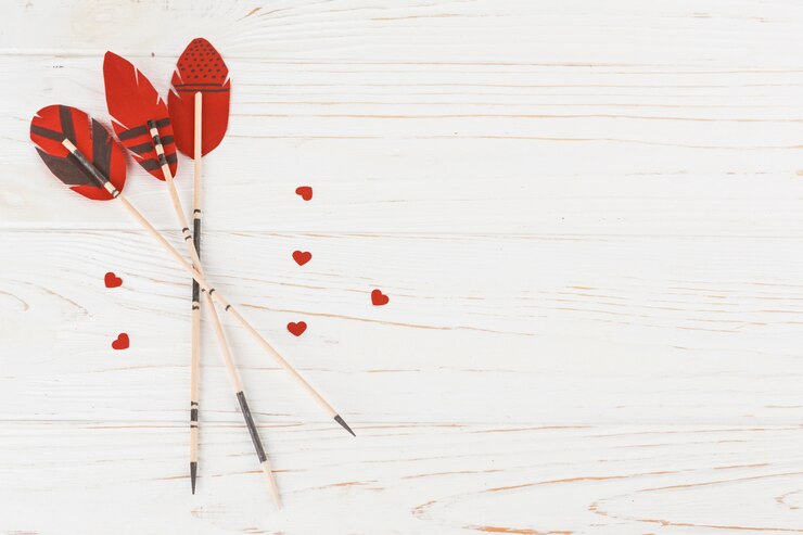 Free Photo decorative feathers on wands near little hearts 