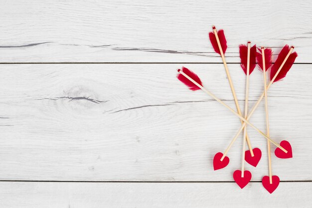 Decorative feathers on wands with little hearts