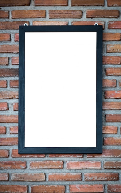 Decorative frame on brick wall