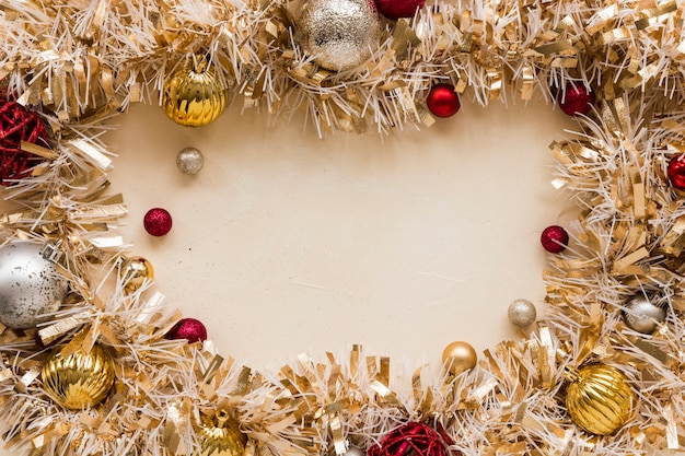 Free photo decorative gold tinsel with ornament balls