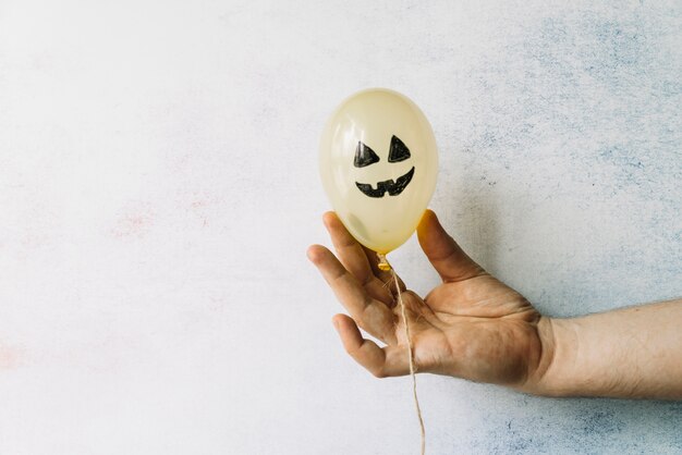 Decorative Halloween balloon with painted scary face